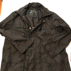 Burberry Rain Jacket/Windbreaker. Mid-length with pockets. Fits more like an XL